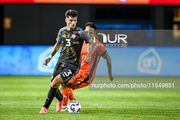 North Macedonia player Gjorge Djekov and Netherlands player Million Manhoef during the match between the Netherlands and North Macedonia at...