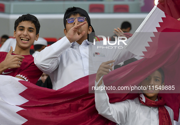 Qatar team supporters cheer for their team during the qualification 3rd round for the FIFA World Cup 2026 group A match between Qatar and Un...