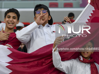 Qatar team supporters cheer for their team during the qualification 3rd round for the FIFA World Cup 2026 group A match between Qatar and Un...