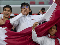 Qatar team supporters cheer for their team during the qualification 3rd round for the FIFA World Cup 2026 group A match between Qatar and Un...