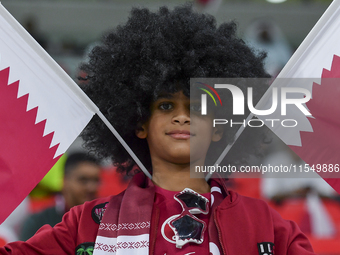 Qatar team supporters cheer for their team during the qualification 3rd round for the FIFA World Cup 2026 group A match between Qatar and Un...