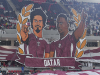 Qatar team supporters cheer for their team during the qualification 3rd round for the FIFA World Cup 2026 group A match between Qatar and Un...