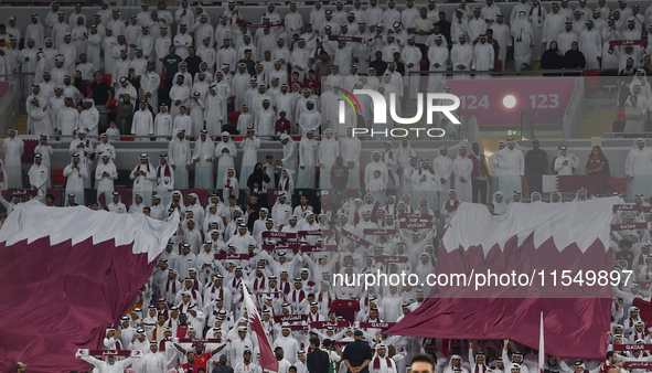 Qatar team supporters cheer for their team during the qualification 3rd round for the FIFA World Cup 2026 group A match between Qatar and Un...