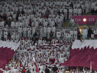 Qatar team supporters cheer for their team during the qualification 3rd round for the FIFA World Cup 2026 group A match between Qatar and Un...