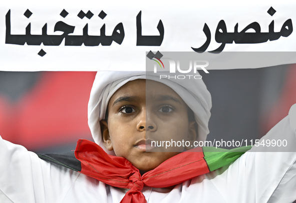 A fan of the United Arab Emirates cheers during the qualification 3rd round for the FIFA World Cup 2026 group A match between Qatar and the...