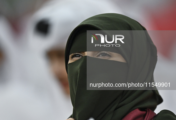 A fan of Qatar cheers during the qualification 3rd round for the FIFA World Cup 2026 group A match between Qatar and the United Arab Emirate...