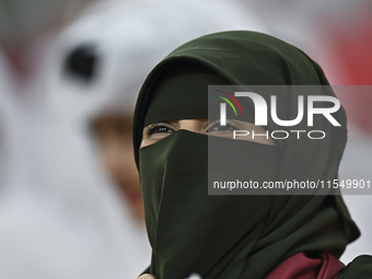 A fan of Qatar cheers during the qualification 3rd round for the FIFA World Cup 2026 group A match between Qatar and the United Arab Emirate...