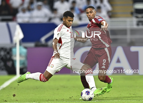 Pedro Correia of Qatar battles for the ball with Yahya Alghassani of the United Arab Emirates during the qualification 3rd round for the FIF...