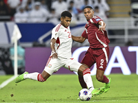 Pedro Correia of Qatar battles for the ball with Yahya Alghassani of the United Arab Emirates during the qualification 3rd round for the FIF...