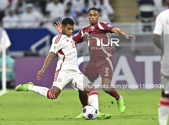 Pedro Correia of Qatar battles for the ball with Yahya Alghassani of the United Arab Emirates during the qualification 3rd round for the FIF...