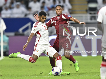 Pedro Correia of Qatar battles for the ball with Yahya Alghassani of the United Arab Emirates during the qualification 3rd round for the FIF...