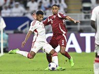 Pedro Correia of Qatar battles for the ball with Yahya Alghassani of the United Arab Emirates during the qualification 3rd round for the FIF...