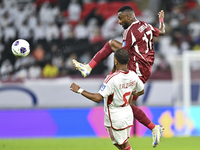 Ahmed Fathy of Qatar battles for the ball with Tahnoon Hamdan of the United Arab Emirates during the qualification 3rd round for the FIFA Wo...