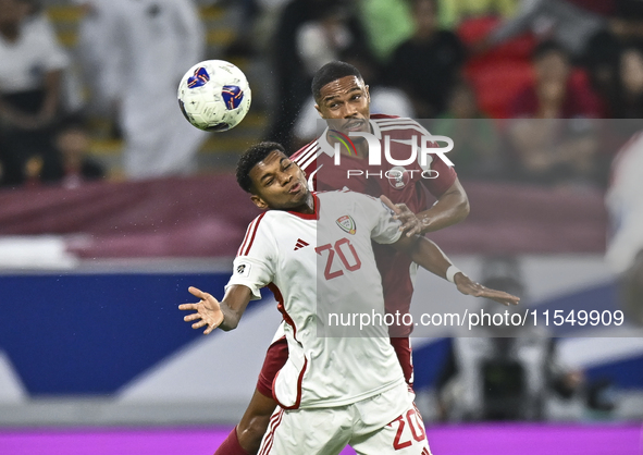 Pedro Correia of Qatar battles for the ball with Yahya Alghassani of the United Arab Emirates during the qualification 3rd round for the FIF...