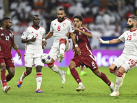 Jassem Gaber (#8) of Qatar battles for the ball with Tahnoon Hamdan (#8) of the United Arab Emirates during the qualification 3rd round for...