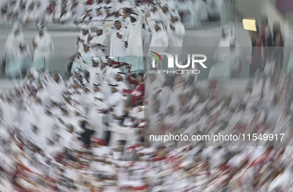 Qatar team supporters cheer for their team during the qualification 3rd round for the FIFA World Cup 2026 group A match between Qatar and Un...