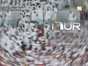 Qatar team supporters cheer for their team during the qualification 3rd round for the FIFA World Cup 2026 group A match between Qatar and Un...