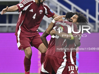 Ibrahim Mohammadali of Qatar celebrates with his teammate after scoring during the qualification 3rd round for the FIFA World Cup 2026 group...