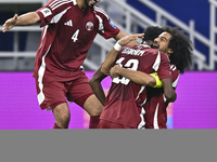 Ibrahim Mohammadali of Qatar celebrates with his teammate after scoring during the qualification 3rd round for the FIFA World Cup 2026 group...