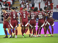 Ibrahim Mohammadali (second from right) of Qatar celebrates with his teammate after scoring during the qualification third round for the FIF...