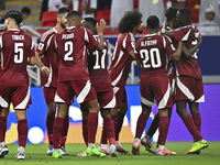 Ibrahim Mohammadali (second from right) of Qatar celebrates with his teammate after scoring during the qualification third round for the FIF...