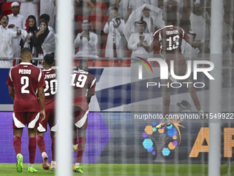 Ibrahim Mohammadali of Qatar celebrates with his teammate after scoring during the qualification 3rd round for the FIFA World Cup 2026 group...