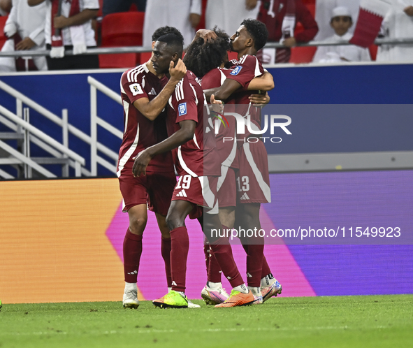 Ibrahim Mohammadali of Qatar celebrates with his teammate after scoring during the qualification 3rd round for the FIFA World Cup 2026 group...