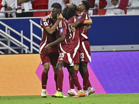 Ibrahim Mohammadali of Qatar celebrates with his teammate after scoring during the qualification 3rd round for the FIFA World Cup 2026 group...