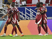 Ibrahim Mohammadali of Qatar celebrates with his teammate after scoring during the qualification 3rd round for the FIFA World Cup 2026 group...