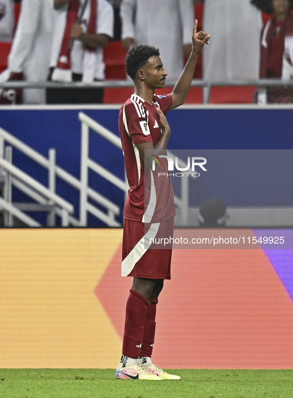 Ibrahim Mohammadali of Qatar celebrates after scoring during the qualification 3rd round for the FIFA World Cup 2026 group A match between Q...