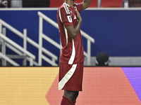 Ibrahim Mohammadali of Qatar celebrates after scoring during the qualification 3rd round for the FIFA World Cup 2026 group A match between Q...