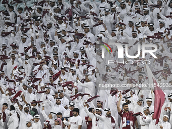 Qatar team supporters cheer for their team during the qualification 3rd round for the FIFA World Cup 2026 group A match between Qatar and Un...