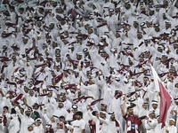 Qatar team supporters cheer for their team during the qualification 3rd round for the FIFA World Cup 2026 group A match between Qatar and Un...