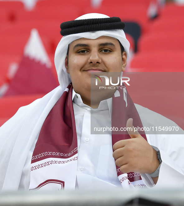 Qatar team supporters cheer for their team during the qualification 3rd round for the FIFA World Cup 2026 group A match between Qatar and Un...