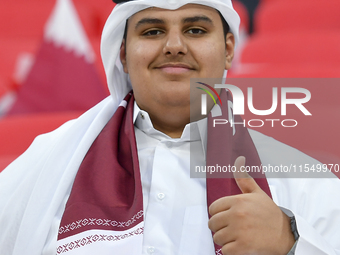 Qatar team supporters cheer for their team during the qualification 3rd round for the FIFA World Cup 2026 group A match between Qatar and Un...