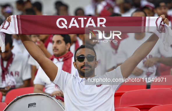 Qatar team supporters cheer for their team during the qualification 3rd round for the FIFA World Cup 2026 group A match between Qatar and Un...