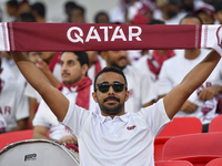 Qatar team supporters cheer for their team during the qualification 3rd round for the FIFA World Cup 2026 group A match between Qatar and Un...