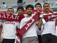 Qatar team supporters cheer for their team during the qualification 3rd round for the FIFA World Cup 2026 group A match between Qatar and Un...