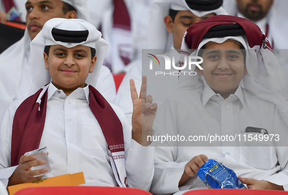 Qatar team supporters cheer for their team during the qualification 3rd round for the FIFA World Cup 2026 group A match between Qatar and Un...