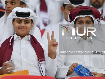 Qatar team supporters cheer for their team during the qualification 3rd round for the FIFA World Cup 2026 group A match between Qatar and Un...