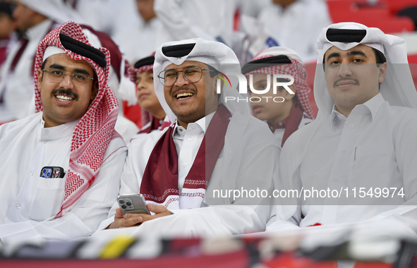 Qatar team supporters cheer for their team during the qualification 3rd round for the FIFA World Cup 2026 group A match between Qatar and Un...