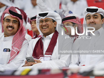 Qatar team supporters cheer for their team during the qualification 3rd round for the FIFA World Cup 2026 group A match between Qatar and Un...