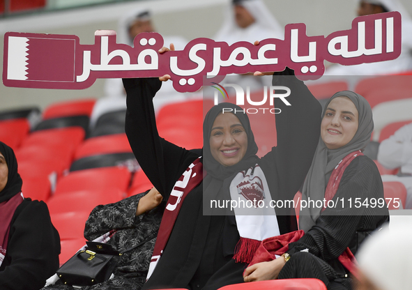 Qatar team supporters cheer for their team during the qualification 3rd round for the FIFA World Cup 2026 group A match between Qatar and Un...