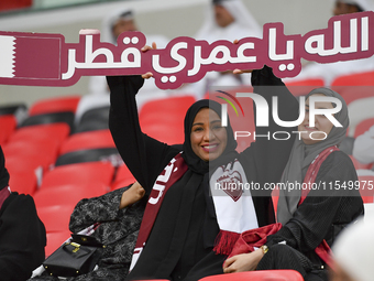 Qatar team supporters cheer for their team during the qualification 3rd round for the FIFA World Cup 2026 group A match between Qatar and Un...