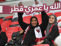 Qatar team supporters cheer for their team during the qualification 3rd round for the FIFA World Cup 2026 group A match between Qatar and Un...