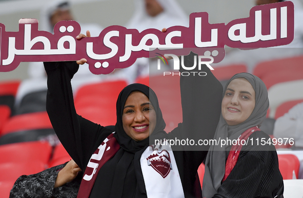 Qatar team supporters cheer for their team during the qualification 3rd round for the FIFA World Cup 2026 group A match between Qatar and Un...