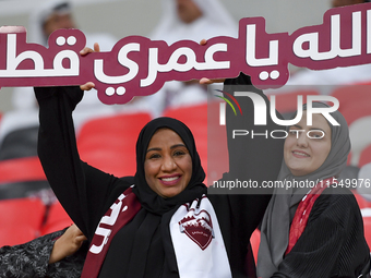 Qatar team supporters cheer for their team during the qualification 3rd round for the FIFA World Cup 2026 group A match between Qatar and Un...