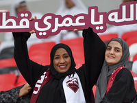 Qatar team supporters cheer for their team during the qualification 3rd round for the FIFA World Cup 2026 group A match between Qatar and Un...