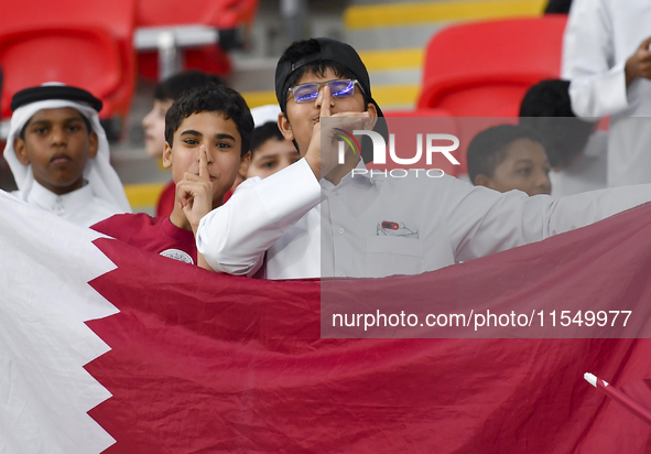 Qatar team supporters cheer for their team during the qualification 3rd round for the FIFA World Cup 2026 group A match between Qatar and Un...