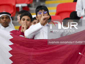 Qatar team supporters cheer for their team during the qualification 3rd round for the FIFA World Cup 2026 group A match between Qatar and Un...